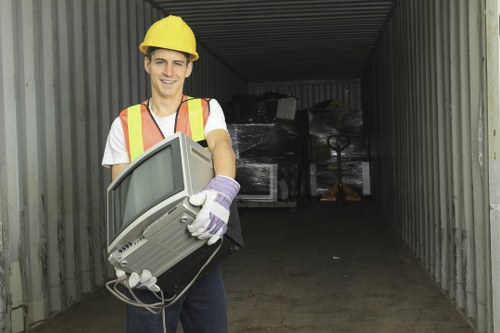 Garden waste collection truck operating in Cricklewood